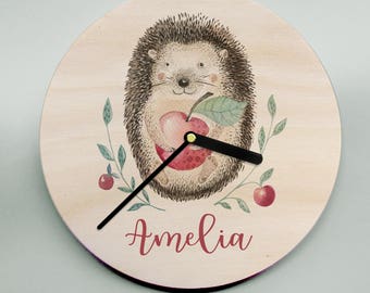 Handmade wooden clock - this adorable hedgehog will brighten up any childs room! Available in two sizes with a personalized name and date.