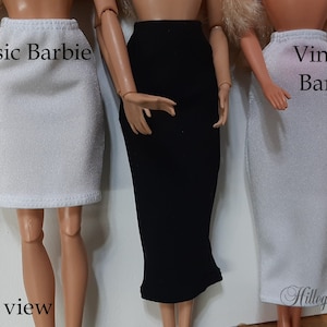 May include: Three Barbie dolls wearing different skirts. The doll on the left is wearing a white skirt, the middle doll is wearing a black skirt, and the doll on the right is wearing a white skirt. The dolls are standing on a white background. The text "Classic Barbie" is above the left doll, "Vintage Barbie" is above the right doll, and "Front view" is below the dolls.