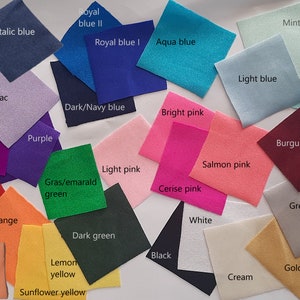 May include: A color chart with 20 fabric swatches in various colors, including red, orange, yellow, green, blue, purple, pink, brown, black, white, grey, and cream. The swatches are labeled with the color names.