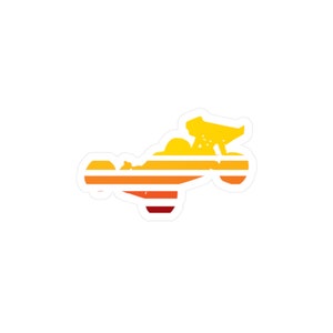 May include: A silhouette of a dune buggy with a sunset-inspired color scheme. The buggy is outlined in white with orange, yellow, and red stripes.