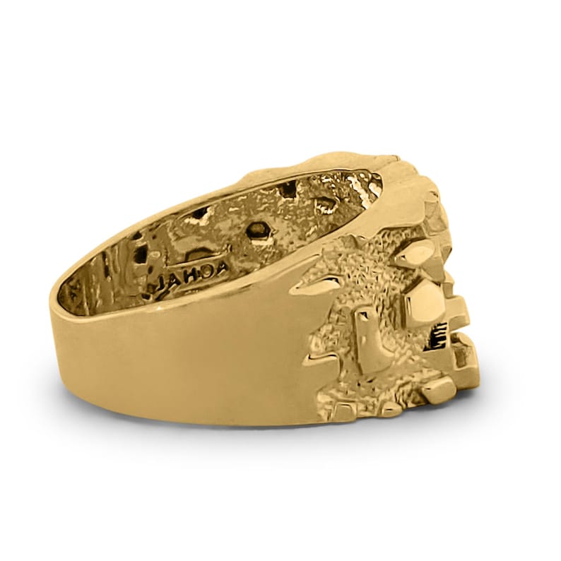 May include: A gold ring with a textured design. The ring is marked with the word "JAHOA" on the inside.