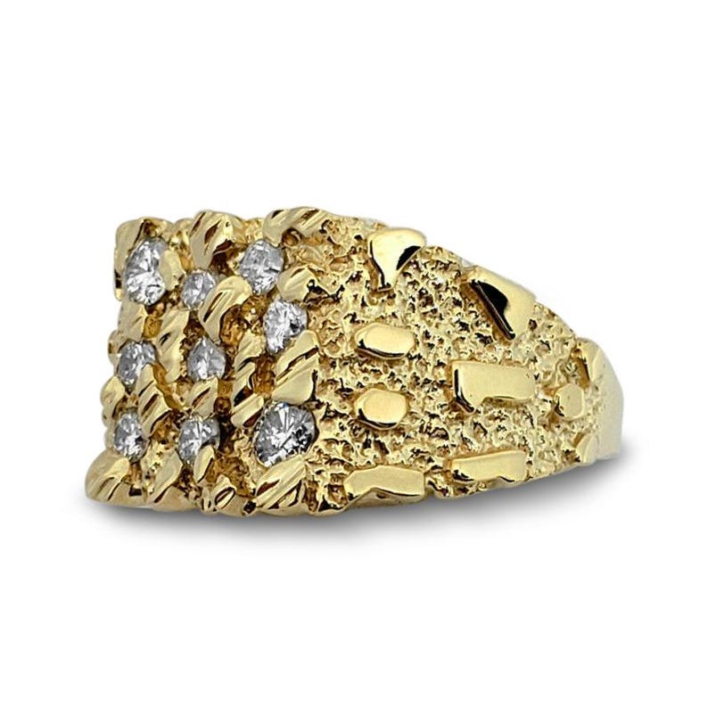 May include: A yellow gold ring featuring a textured, nugget-style surface. The front of the ring is set with nine round, clear, faceted stones arranged in a grid pattern, embedded directly into the irregular, bumpy gold metal finish.