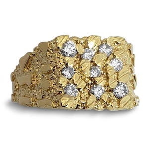 A gold ring with a rough, jagged texture and numerous small diamonds set in it.