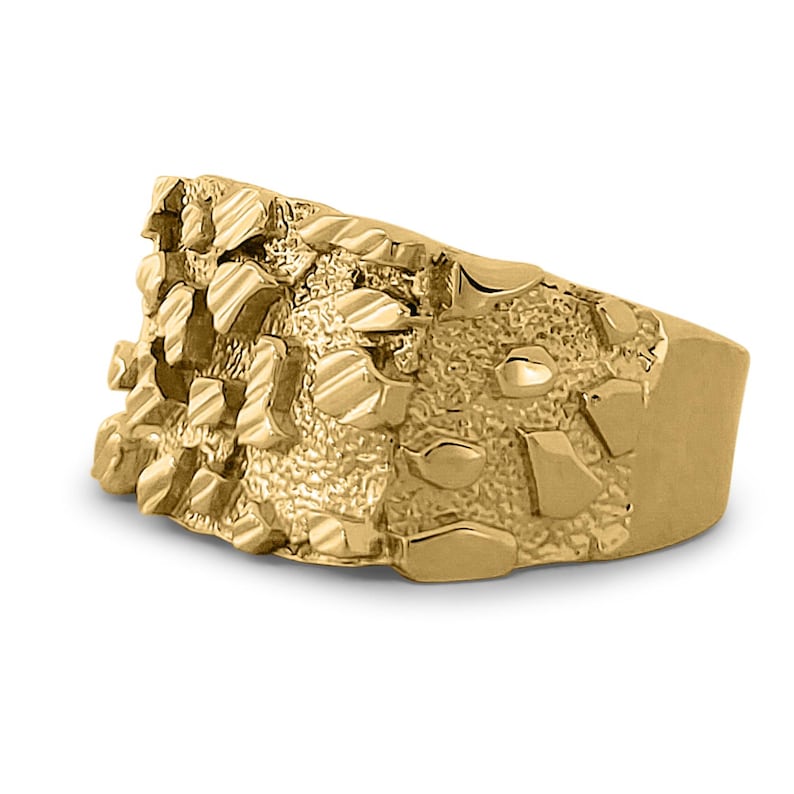 May include: A gold ring with a textured, nugget-like design. The ring is wide and has a flat top.