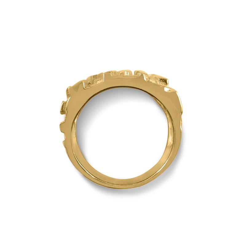 May include: A gold ring with a textured design. The ring is made of a single band and has a smooth, polished finish.
