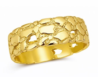 May include: A gold nugget ring with a textured surface. The ring has a wide band and a series of irregular, raised shapes across the top. The ring is made of a shiny, reflective metal.