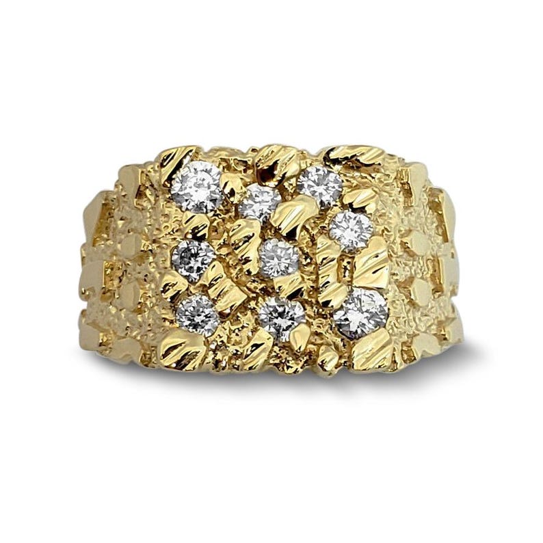 May include: A gold ring featuring a textured, nugget-style band with a wide, rectangular face. The surface of the ring is embedded with nine round, clear, faceted stones arranged in a grid pattern across the irregular, metallic gold surface.