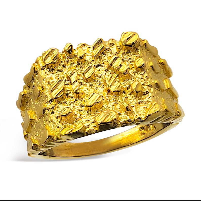 May include: A gold nugget ring with a textured surface. The ring is made of 10k gold.