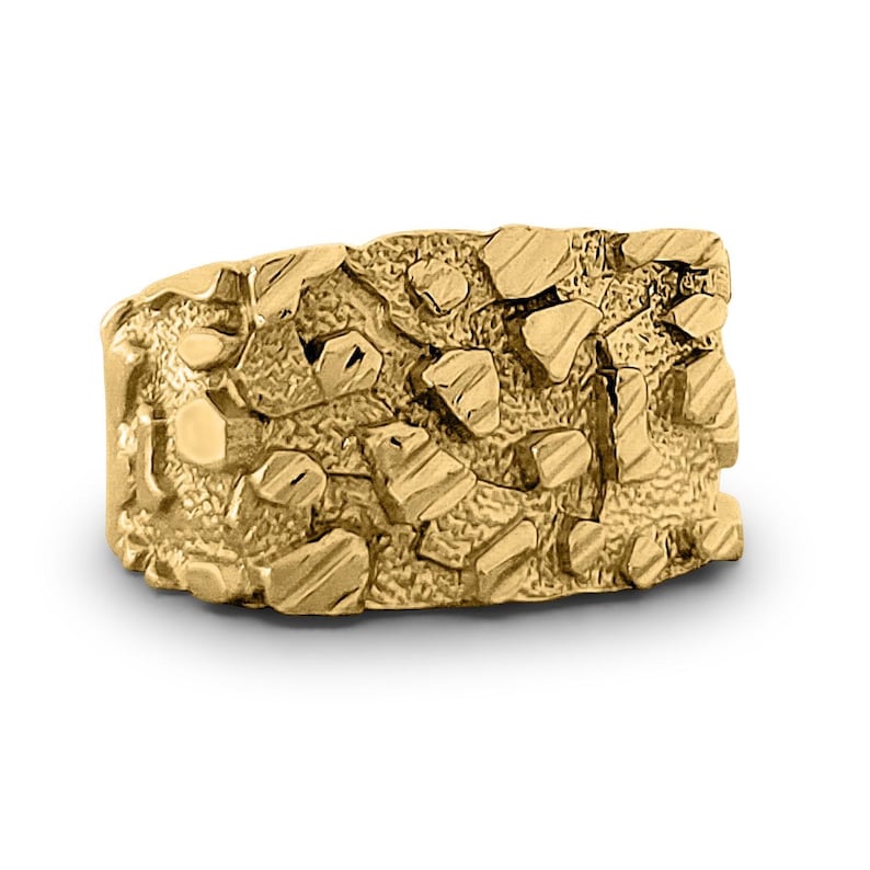 May include: A gold ring with a textured, nugget-like design.