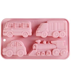 May include: A pink silicone mold featuring four vehicle shapes: a bus, a truck, a car, and a train. The mold is rectangular with rounded corners. The vehicles are in a cartoon style, perfect for making treats.