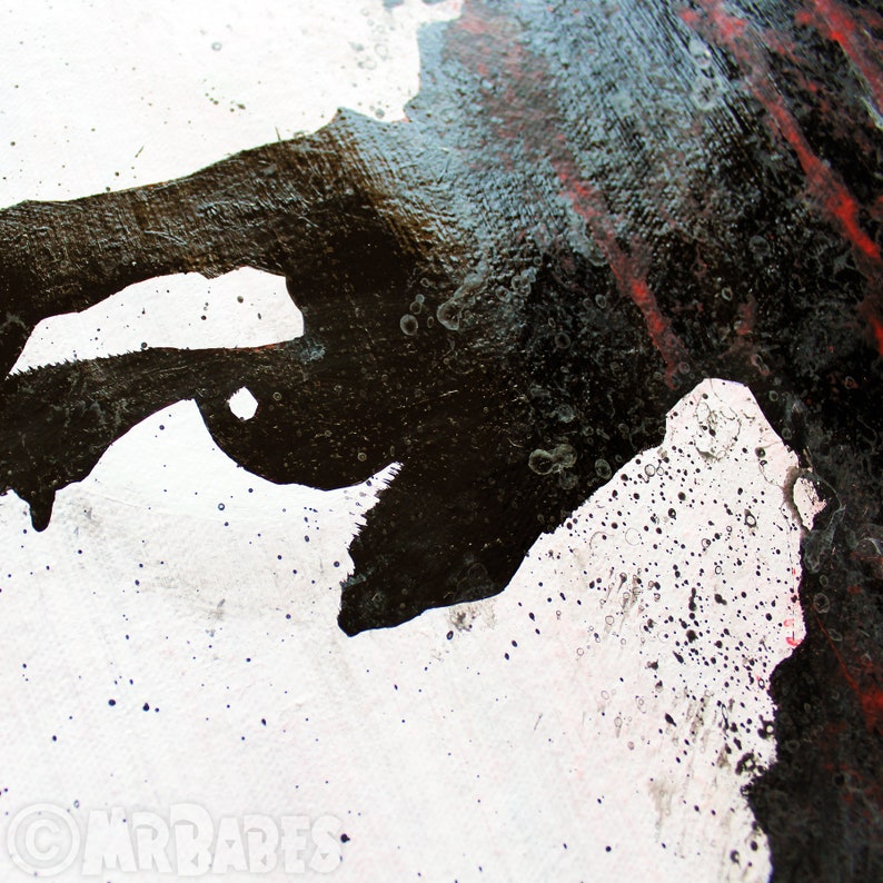 May include: Abstract art painting with black, white, and red paint splatters on a white canvas. The black paint is thick and textured, creating a dramatic effect.