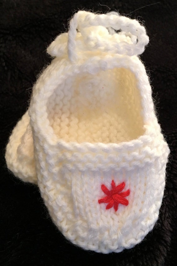 white knitted baby booties