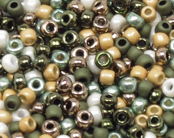 May include: A mix of seed beads in various colors, including green, white, brown, and gold. The beads are small and round, and they are perfect for jewelry making or other craft projects.