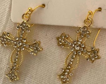 Christian Cross pierced gold dangling earrings.