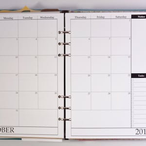 May include: A teal leather bound planner with a monthly calendar for October 2016. The calendar has sections for Sunday, Monday, Tuesday, Wednesday, Thursday, Friday, Saturday, Notes, Tasks, and Projects.