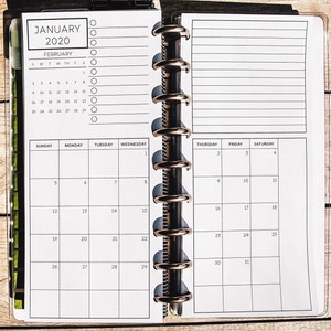 May include: A white monthly planner with a black and white calendar grid for February 2020. The planner has a ring binding and a section for notes.
