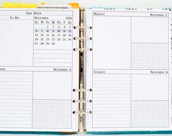 May include: A teal and black planner with a monthly calendar for November 2016. The planner has a to-do list, daily pages, and a projects section.