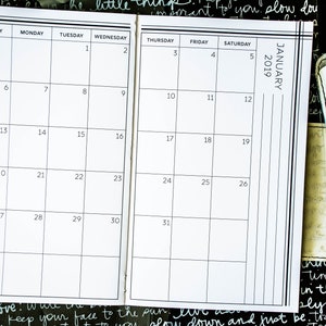 May include: A black and white calendar for January 2019. The calendar is divided into seven columns for each day of the week, with the days of the week labelled at the top. The numbers 1 through 31 are printed in the boxes for each day of the month.