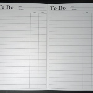 May include: A white to-do list notebook with a yellow spine. The notebook is open to two blank pages with lined paper. The pages are labeled "To Do" with columns for "Date" and "Category".