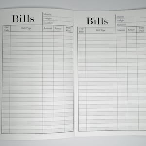 May include: A black and white printable bill tracker with columns for due date, bill type, amount, actual paid, and date paid. The tracker has the word "Bills" at the top of each page.