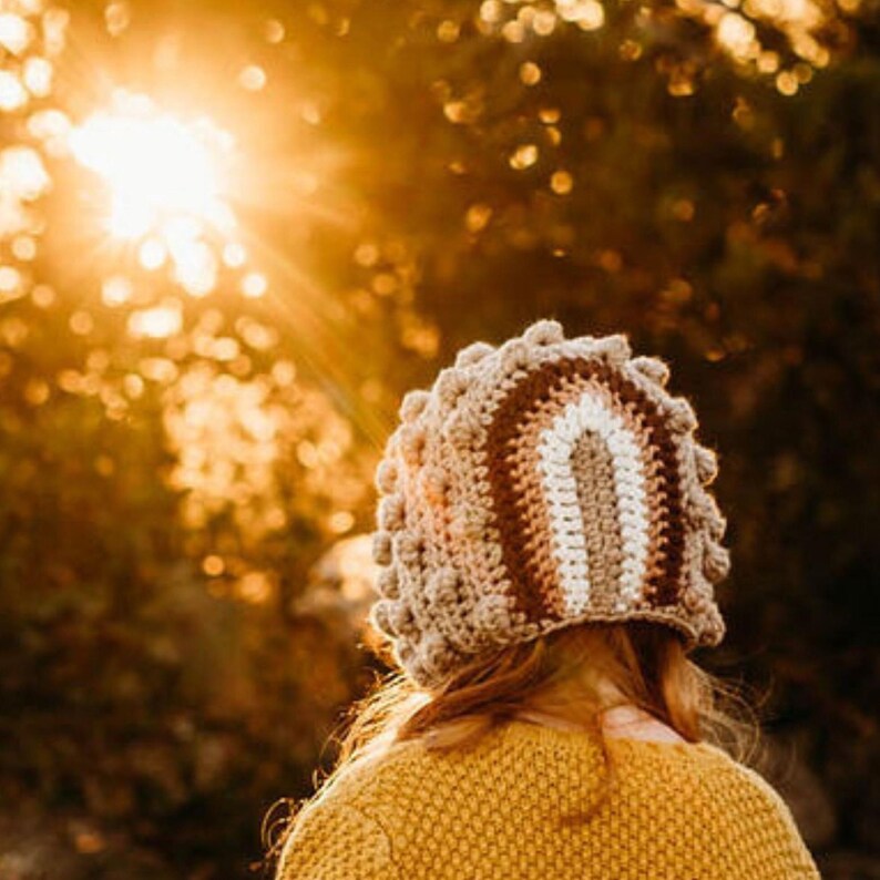 Our sweet handmade rainbow baby bonnet make a wonderful photo prop, a terrific gift for a new mother or for everyday wear! This bonnet is made to order in our soft acrylic yarn and is available in several different colors available in our options.