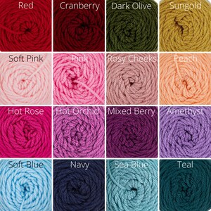 May include: A grid of yarn skeins in various colors. Colors include red, cranberry, dark olive, sungold, soft pink, pink, rosy cheeks, peach, hot rose, hot orchid, mixed berry, amethyst, soft blue, navy, sea blue, and teal.