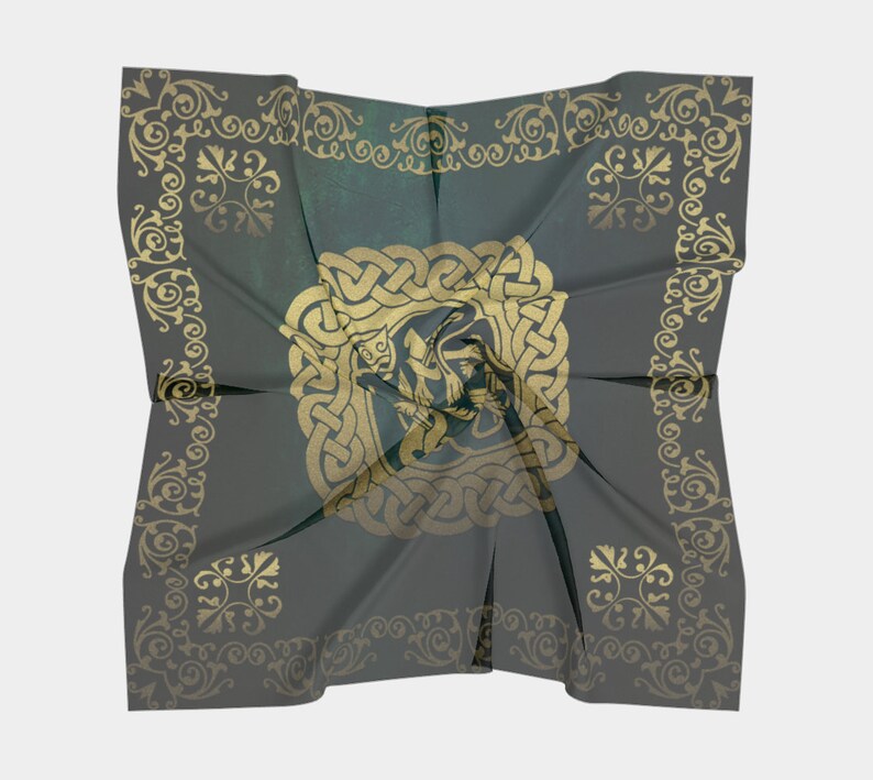 The backside of this green and gold patterned scarf is displayed to show that the Celtic knot design is shows on the back but is slightly muted.