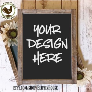 May include: A rustic wooden framed chalkboard with a black surface. The chalkboard has the text "YOUR DESIGN HERE" written in white chalk. The chalkboard is sitting on a white wooden surface.