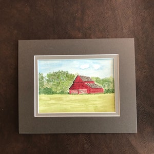 Watercolor painting of red barn