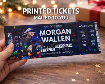 May include: A concert ticket for the Morgan Wallen Still The Problem Tour 2026, with the date 05/05/2026. The ticket is black with holographic accents and features the artist's image. The ticket is being held by a person.