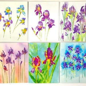 May include: Six watercolor paintings of irises in various stages of bloom. The flowers are depicted in shades of purple, yellow, and blue, with green stems and leaves. The backgrounds are soft washes of color, creating a delicate and artistic feel.