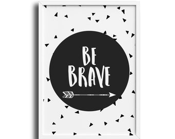 May include: Black and white framed print with a black circle containing the text "BE BRAVE" and a small arrow. The background is white with a scattered pattern of black triangles.