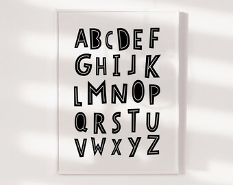 May include: Black and white alphabet poster with bold, outlined letters. The letters are arranged in three rows, with the first row being A-F, the second row being G-K, and the third row being L-Z.