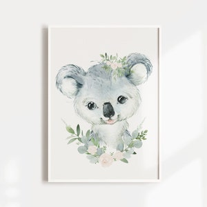 May include: A watercolour illustration of a koala wearing a floral crown. The koala is grey with a pink nose and tongue. The flowers in the crown are pink and white. The background is white.