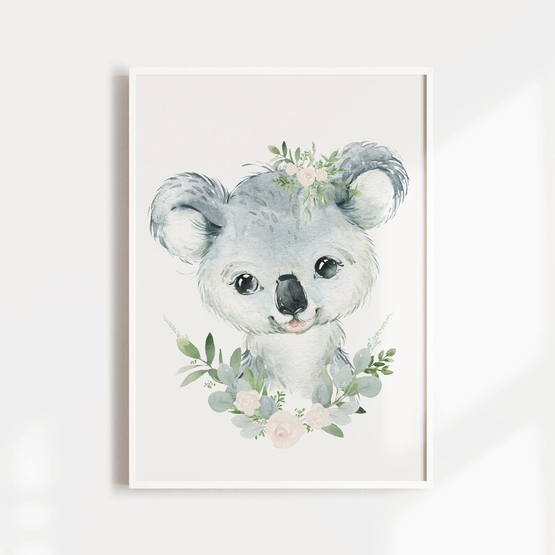 May include: A watercolour illustration of a koala wearing a floral crown. The koala is grey with a pink nose and tongue. The flowers in the crown are pink and white. The background is white.