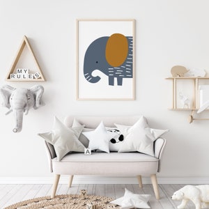 May include: A light gray couch with two white pillows and a white star-shaped pillow with a black panda bear design. A framed print of a blue and brown elephant is hanging on the wall above the couch. The couch is in a room with a wooden shelf and a wooden triangle shelf with the words "MY RULES" on it.
