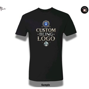May include: Black t-shirt with the text "CUSTOM BLING+ LOGO" in gold lettering, along with a blue and silver design. The shirt has short sleeves and a crew neck. The word "Sample" is at the bottom.
