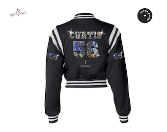 May include: Black varsity jacket with white stripes on the sleeves. The back features the name "CURTIS" and the number "56" in a sparkling, colorful design. The jacket has a custom arrow and the text "Custom" below the number.