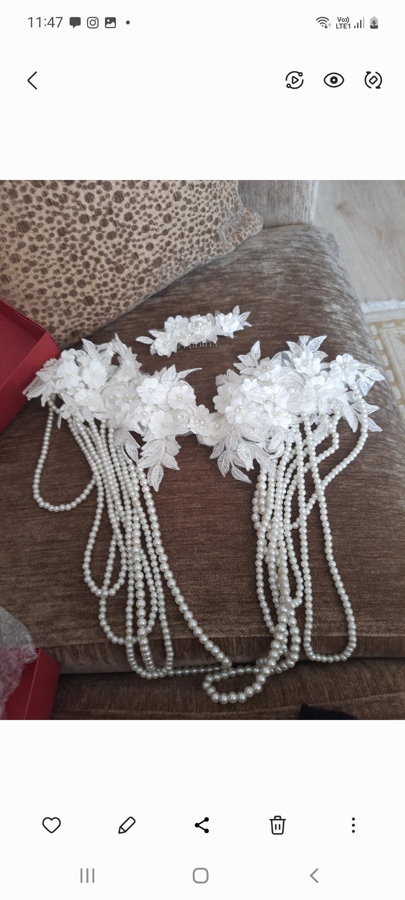 May include: A set of white pearl and lace hair accessories. The set includes two hair combs with white lace flowers and pearls, and two strands of pearls.