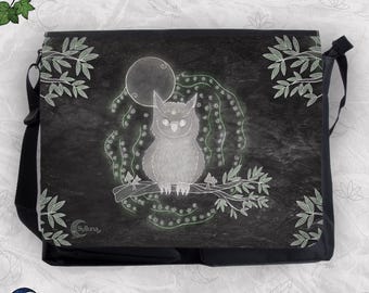 May include: A black messenger bag featuring a white line art illustration of an owl perched on a branch in front of a full moon. The design includes leafy sprigs in the corners and the text Sylluna printed near the bottom left corner.