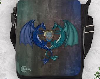 May include: A black messenger bag featuring a flap with a watercolor-style background in shades of blue, green, and gray. The design displays two dragons, one blue and one teal, holding a central shield with a triangle symbol. The text Sylluna is visible.