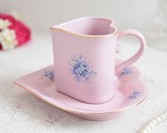 Heart-Shaped Pink Cup and Saucer with Blue Floral Design and Gold Trim