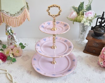 Pink porcelain cake stander with floral decorations by LL