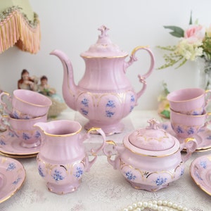Pink porcelain coffee set with floral and gold decorations