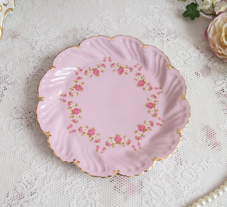 Pink porcelain dessert plate with pink and white flowers and 24 k gold decoration