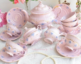 Collectibles pink porcelain coffee set with floral and gold decorations