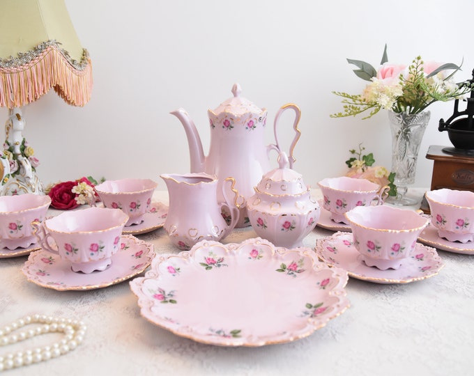 Pink porcelain coffee set with floral and gold decorations