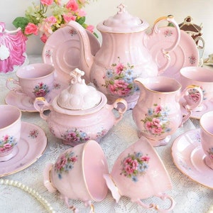 Pink porcelain coffee set with floral and gold decorations