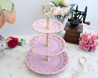 Pink porcelain cake stander with floral decorations by LL