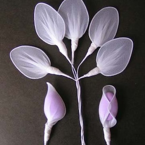 May include: A bouquet of white tulle flower petals with purple fabric flower buds. The petals are attached to a white stem.